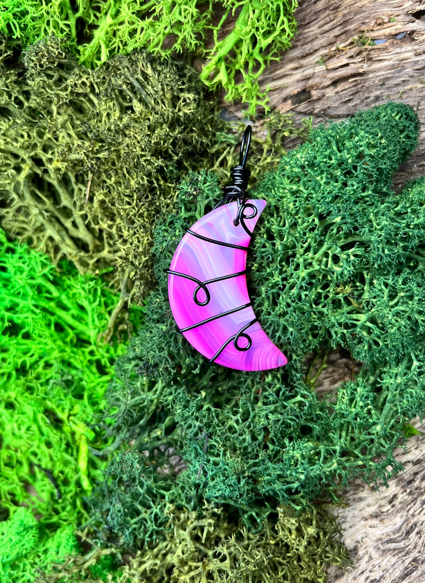 Dyed Pink Agate Crescent Moon Pendant – Black Wire Wrapped with Swirl Design