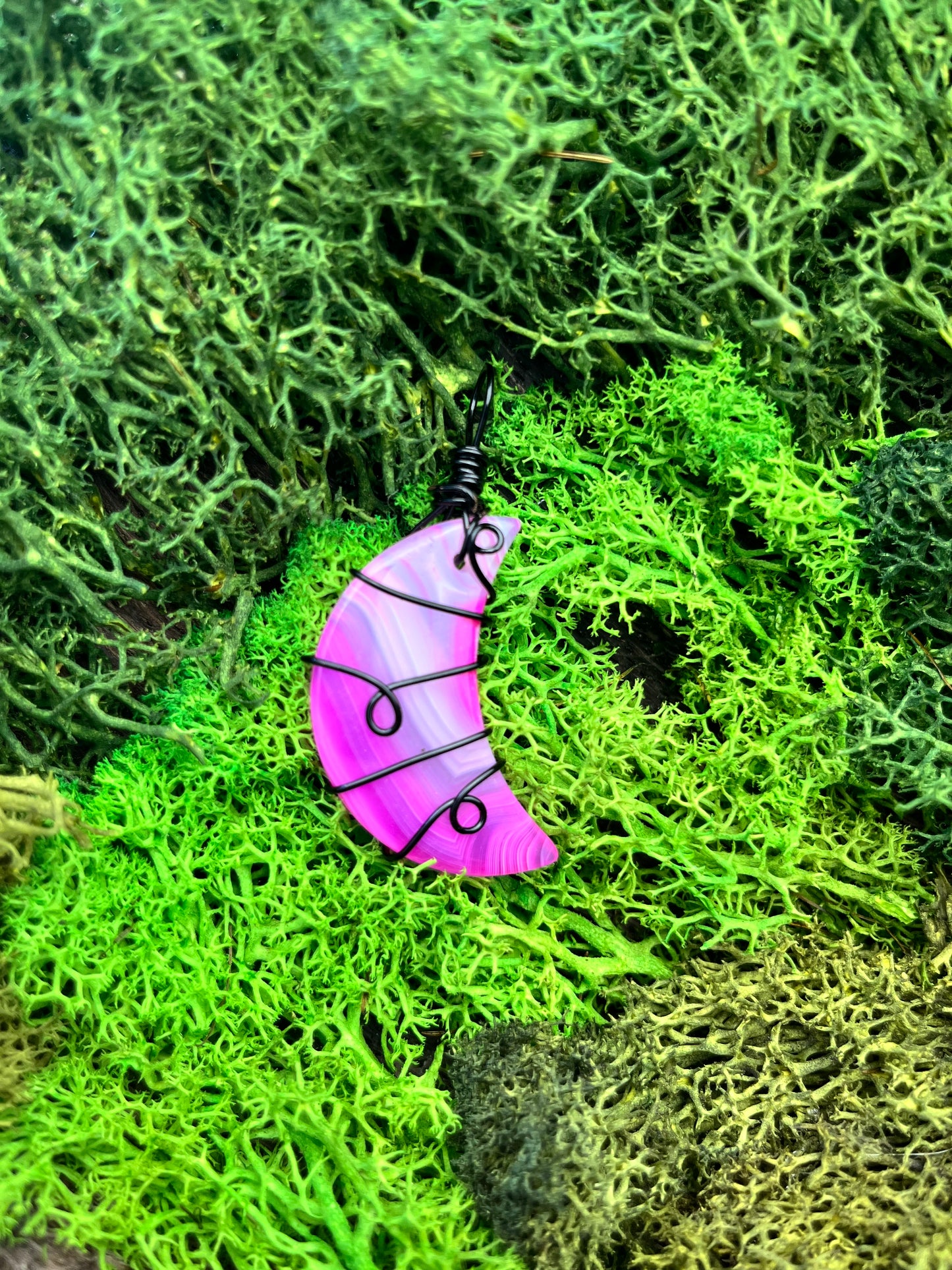 Dyed Pink Agate Crescent Moon Pendant – Black Wire Wrapped with Swirl Design