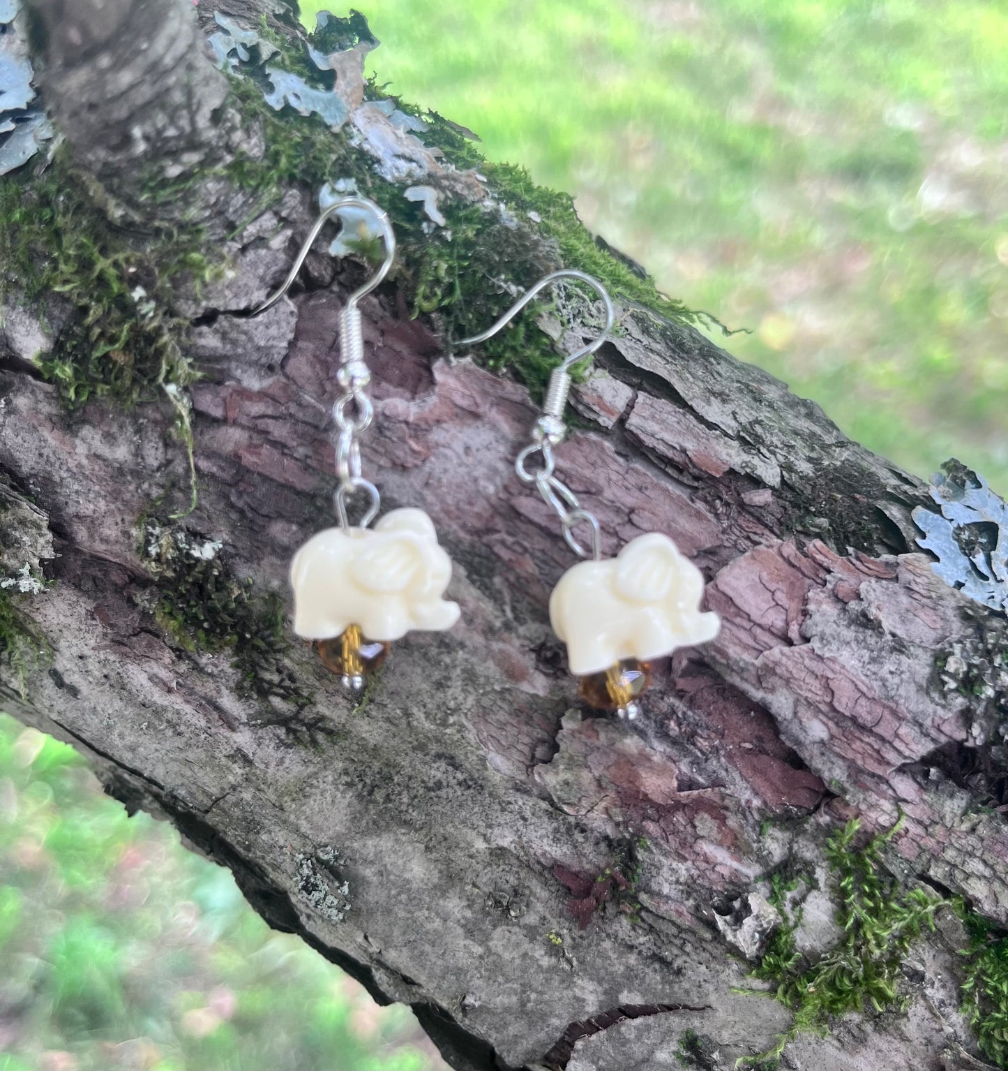 Cream Elephant Dangle Earrings with Amber Crystal Accents