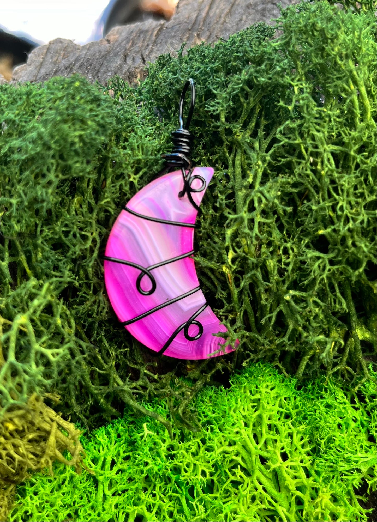 Dyed Pink Agate Crescent Moon Pendant – Black Wire Wrapped with Swirl Design
