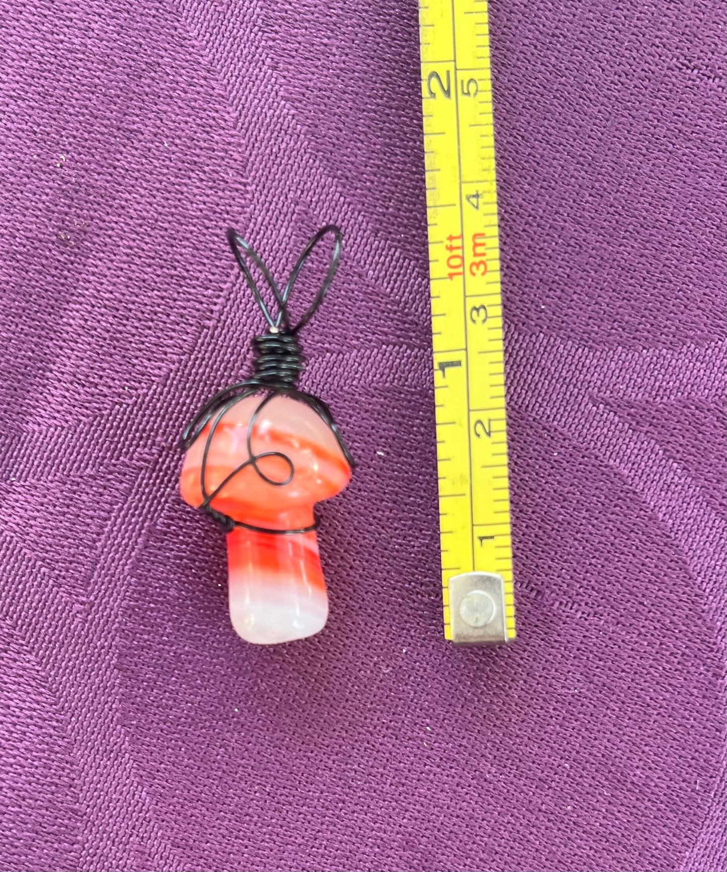 Orange Swirled Agate Mushroom in black wire, pendant necklace