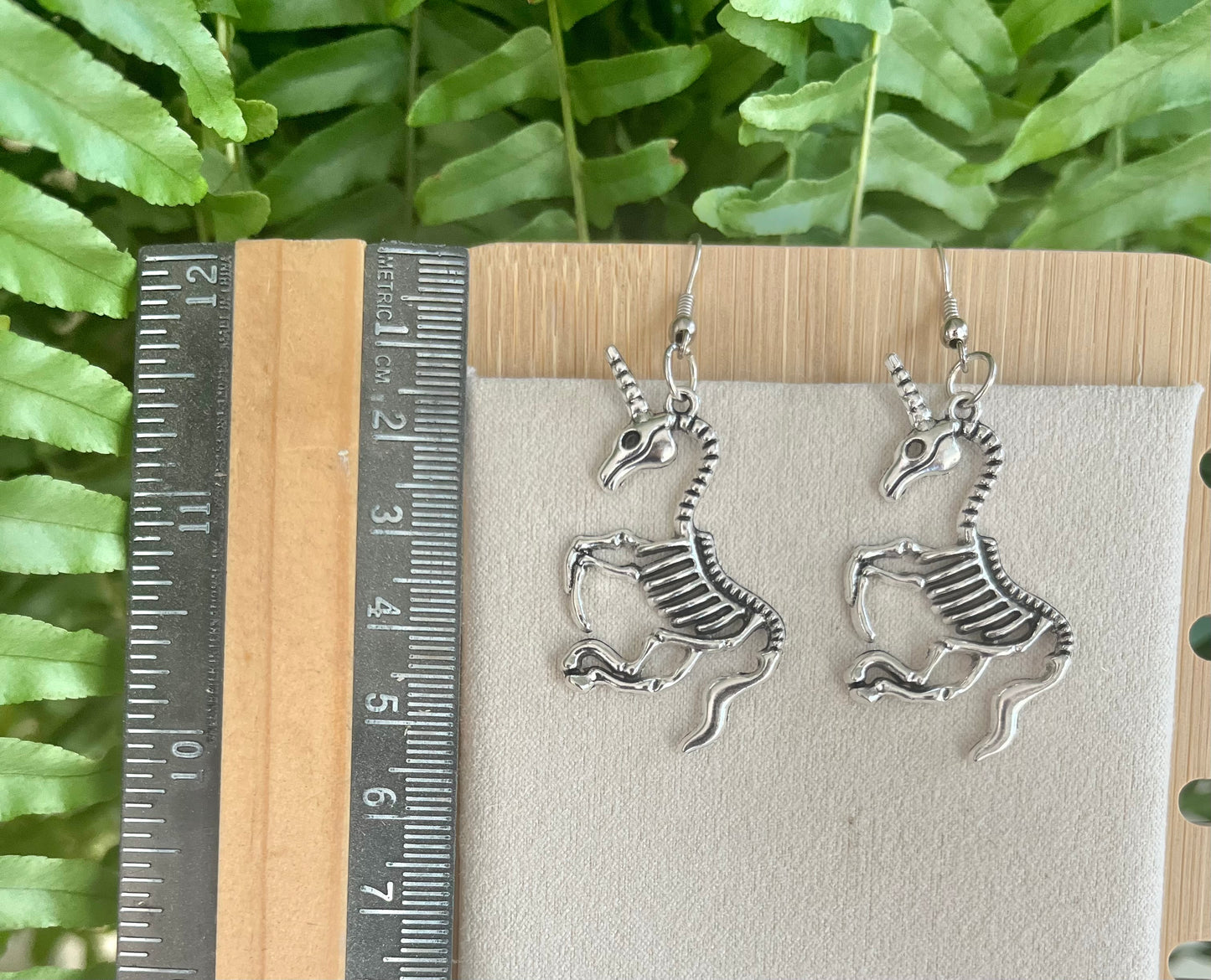 Unicorn Skeleton Earrings on silver stainless steel hooks