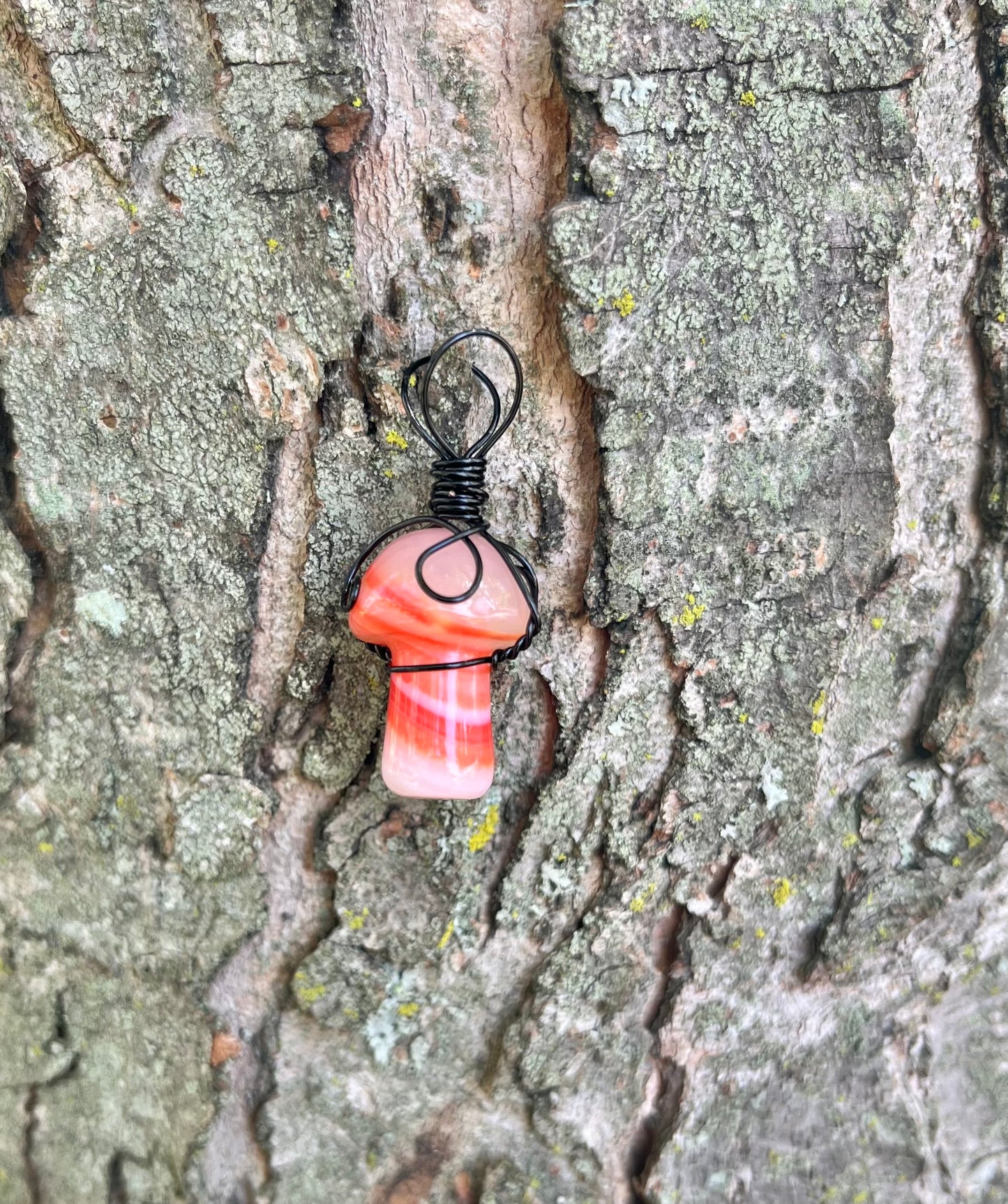 Orange Swirled Agate Mushroom in black wire, pendant necklace