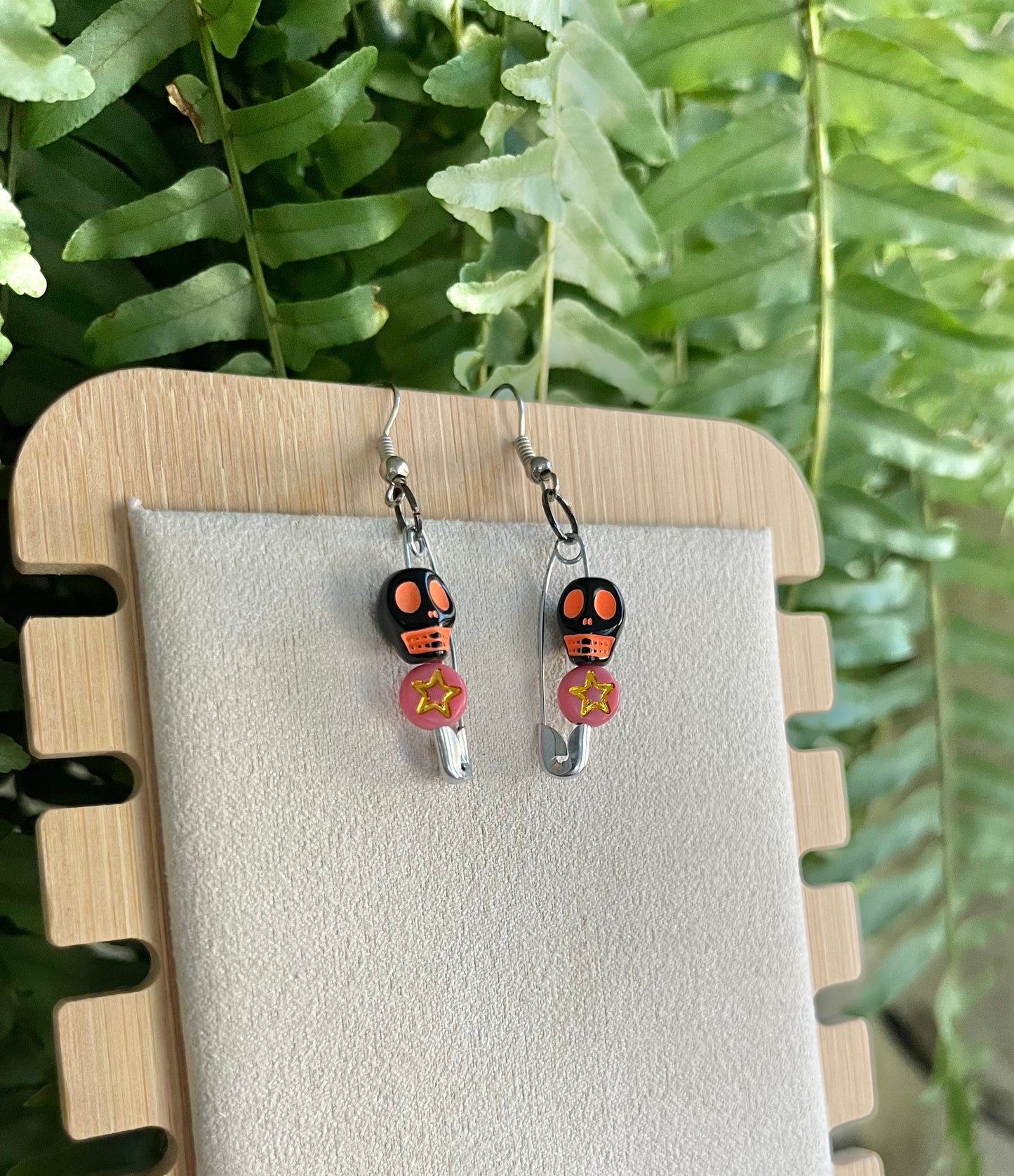 Orange & Black Skull Safety Pin Earrings on silver stainless steel hooks