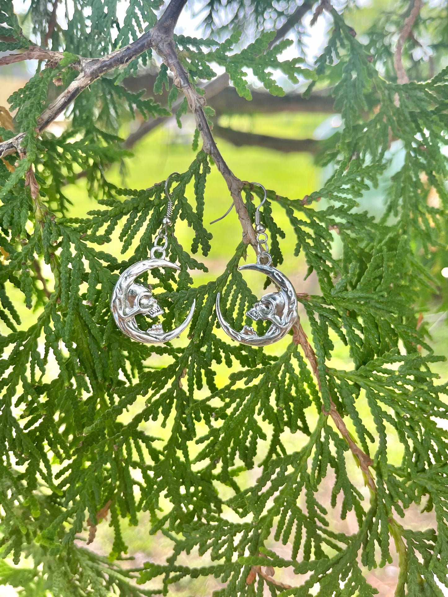 Skull on Crescent Moon Earrings on silver stainless steel hooks