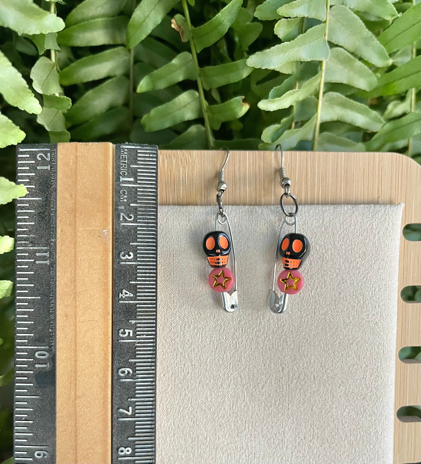 Orange & Black Skull Safety Pin Earrings on silver stainless steel hooks