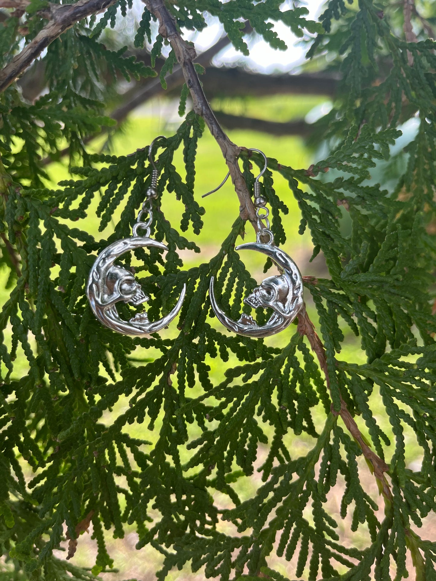 Skull on Crescent Moon Earrings on silver stainless steel hooks